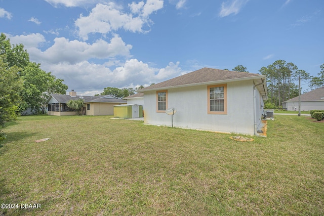 back of house featuring a yard