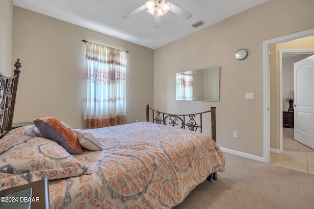 bedroom featuring ceiling fan and light colored carpet