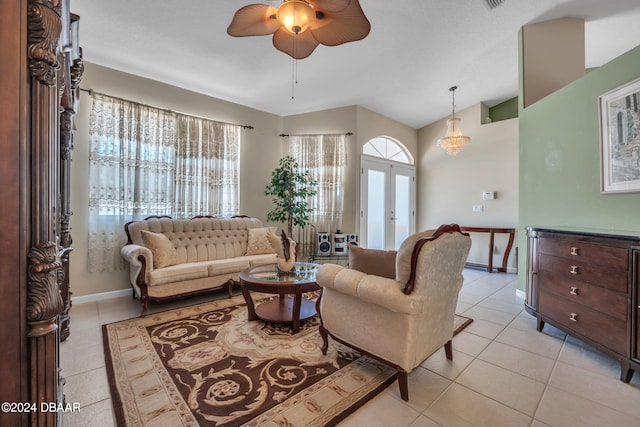 living room featuring ceiling fan, french doors, and light tile patterned floors