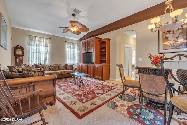 living room featuring ceiling fan with notable chandelier and light colored carpet