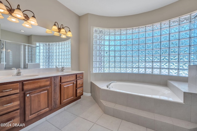 bathroom with tile patterned flooring, plenty of natural light, and vanity