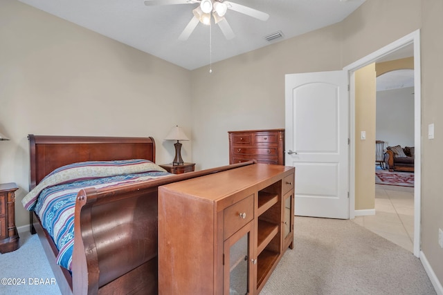 bedroom with light colored carpet and ceiling fan