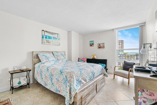 tiled bedroom with a textured ceiling