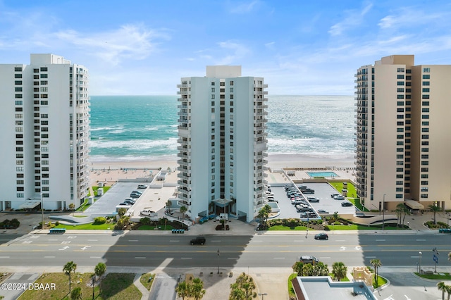 exterior space with a beach view and a water view