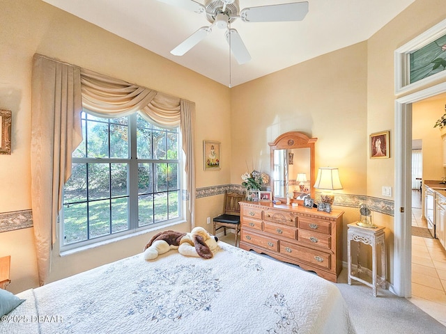 carpeted bedroom with multiple windows and ceiling fan