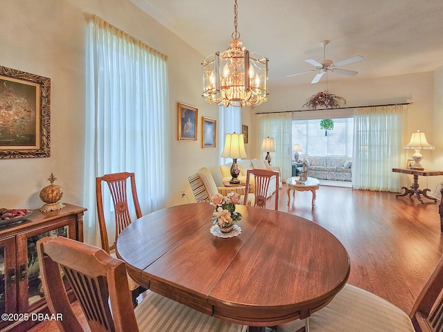 dining space with hardwood / wood-style flooring