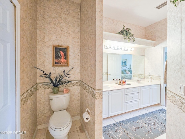 bathroom with tile patterned floors, toilet, and vanity