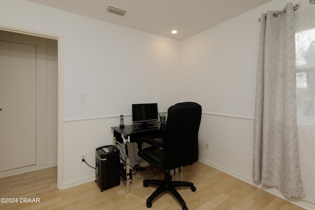 office space with hardwood / wood-style floors