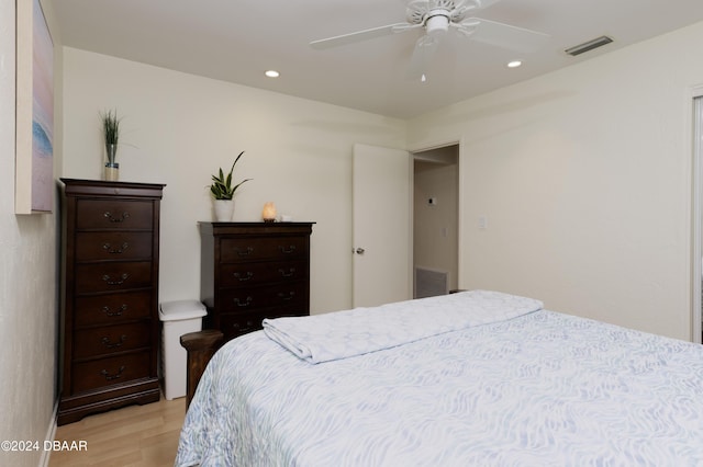 bedroom featuring light hardwood / wood-style floors and ceiling fan