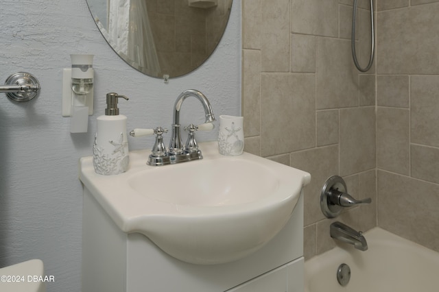 bathroom with shower / bath combo and vanity