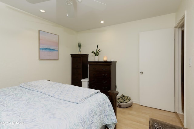 bedroom featuring light hardwood / wood-style floors and ceiling fan