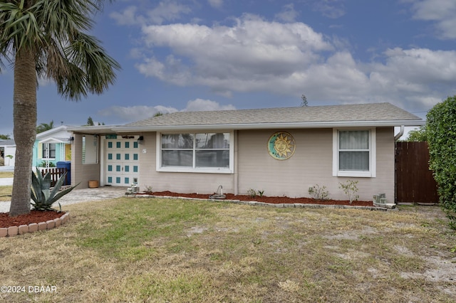 ranch-style house with a front yard