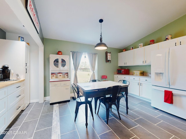 dining room with lofted ceiling