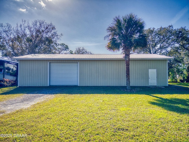 garage with a lawn