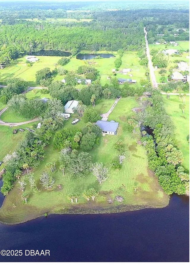 birds eye view of property featuring a water view and a rural view