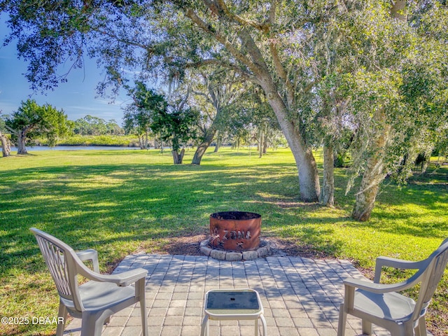 view of patio with an outdoor fire pit