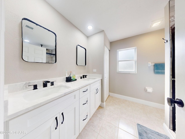 bathroom featuring tile patterned floors and vanity