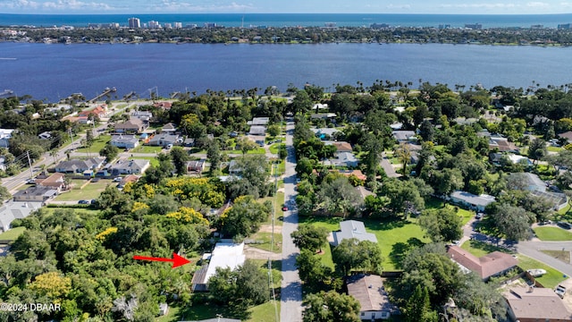 birds eye view of property with a water view