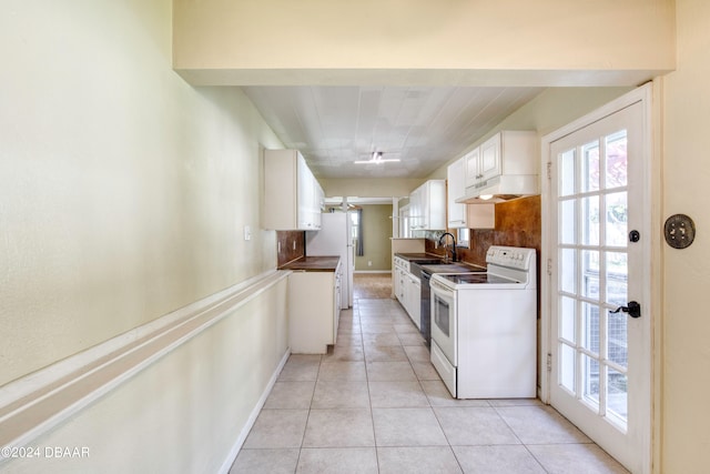 kitchen with backsplash, white cabinetry, light tile patterned floors, sink, and white appliances