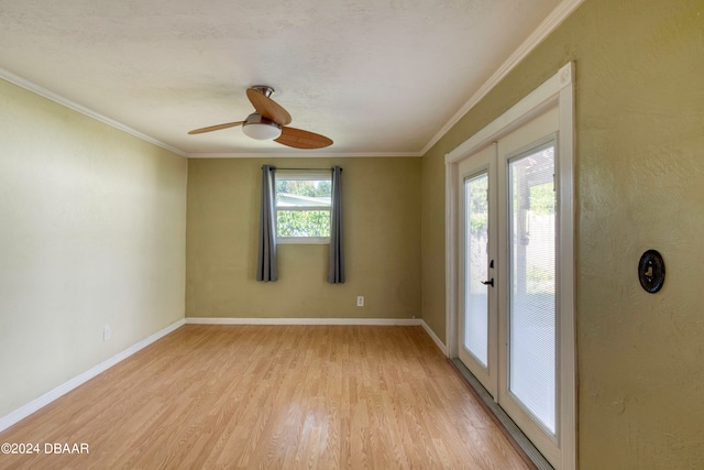 spare room with french doors, light hardwood / wood-style flooring, ceiling fan, and crown molding