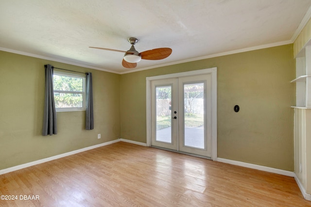 unfurnished room featuring french doors, plenty of natural light, and light hardwood / wood-style floors