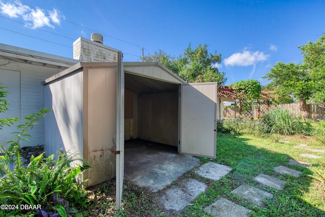 view of outbuilding with a lawn