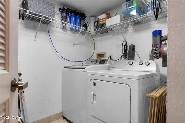 clothes washing area with washer and dryer