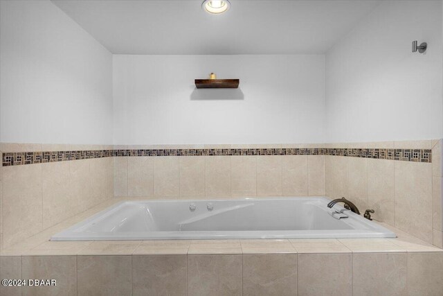 bathroom featuring a relaxing tiled tub