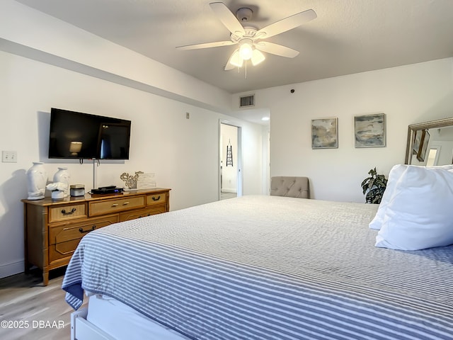 5300 S Atlantic Ave Unit 10-205, New Smyrna Beach, FL 32168 - bedroom with baseboards, visible vents, a ceiling fan, and light wood-style floors