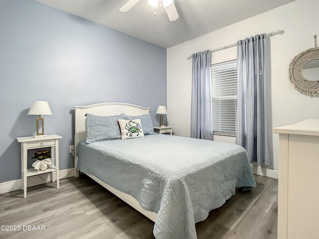 5300 S Atlantic Ave Unit 10-205, New Smyrna Beach, FL 32168 - bedroom featuring wood finished floors, ceiling fan, and baseboards