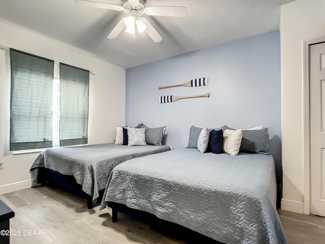 5300 S Atlantic Ave Unit 10-205, New Smyrna Beach, FL 32168 - bedroom featuring light wood-style floors, ceiling fan, and baseboards