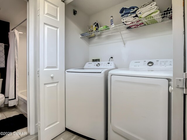 5300 S Atlantic Ave Unit 10-205, New Smyrna Beach, FL 32168 - washroom with separate washer and dryer and laundry area