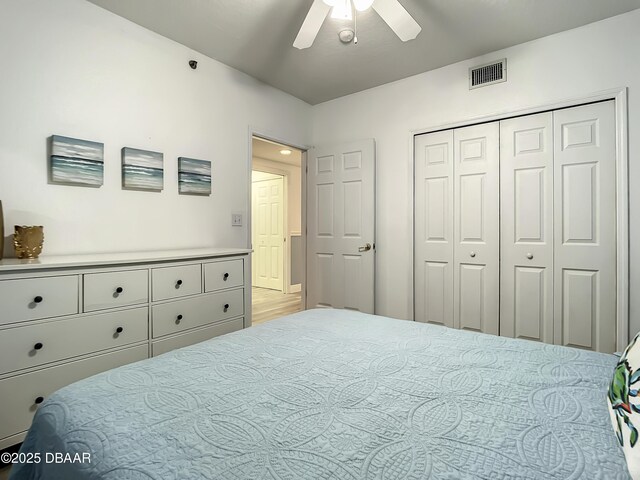 5300 S Atlantic Ave Unit 10-205, New Smyrna Beach, FL 32168 - bedroom featuring a ceiling fan, visible vents, and a closet