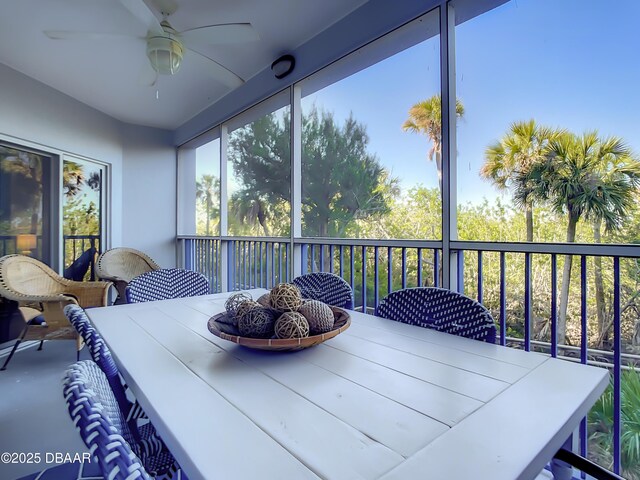 5300 S Atlantic Ave Unit 10-205, New Smyrna Beach, FL 32168 - sunroom / solarium featuring outdoor dining area and ceiling fan