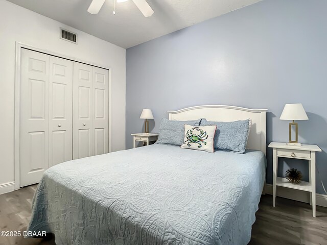 5300 S Atlantic Ave Unit 10-205, New Smyrna Beach, FL 32168 - bedroom with ceiling fan, visible vents, baseboards, a closet, and wood finished floors