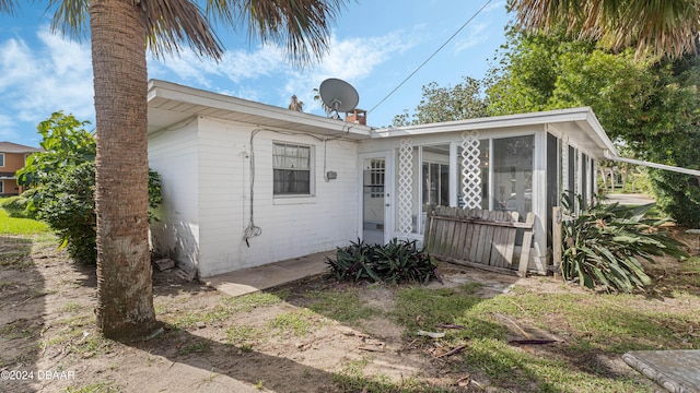 view of front of property with a sunroom