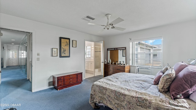 carpeted bedroom featuring ensuite bathroom and ceiling fan