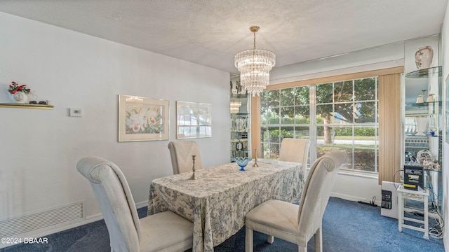 dining space featuring a textured ceiling and carpet floors