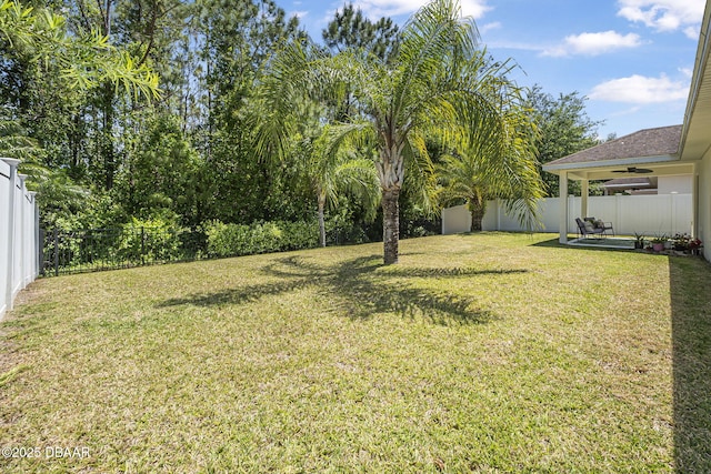 43 Pergola Pl, Ormond Beach, FL 32174 - view of yard with ceiling fan, a fenced backyard, and a patio area