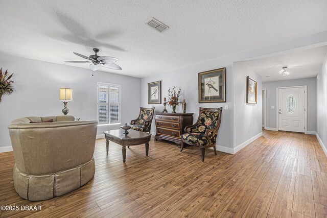 43 Pergola Pl, Ormond Beach, FL 32174 - living area featuring ceiling fan, a healthy amount of sunlight, wood finished floors, and visible vents