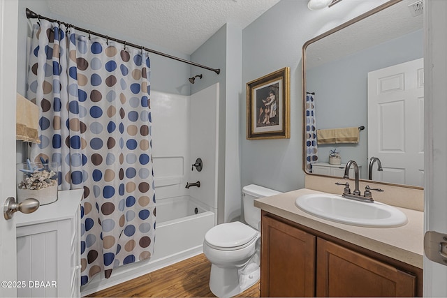 43 Pergola Pl, Ormond Beach, FL 32174 - bathroom with wood finished floors, a textured ceiling, vanity, shower / tub combo with curtain, and toilet