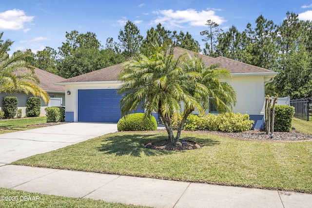 43 Pergola Pl, Ormond Beach, FL 32174 - view of front of home with stucco siding, concrete driveway, a front yard, and a garage