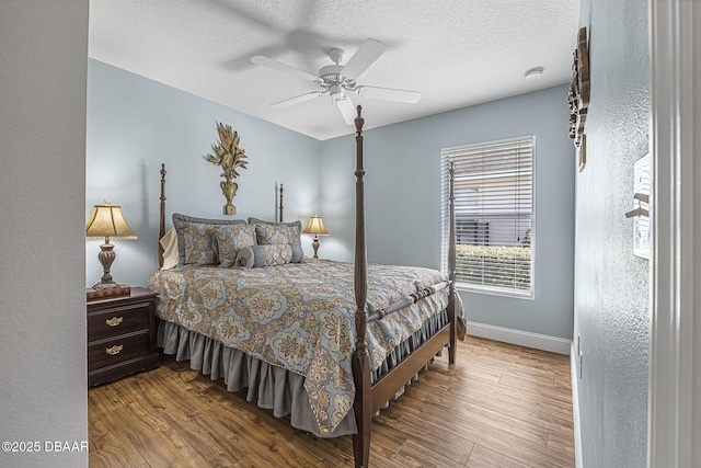 43 Pergola Pl, Ormond Beach, FL 32174 - bedroom featuring baseboards, a ceiling fan, wood finished floors, and a textured ceiling