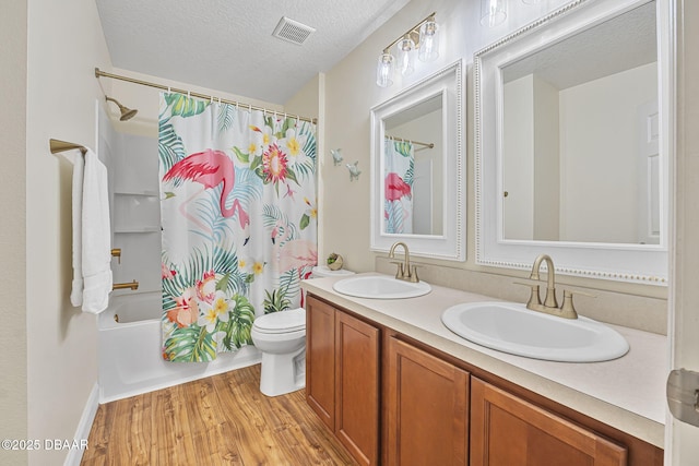 43 Pergola Pl, Ormond Beach, FL 32174 - bathroom featuring wood finished floors, a sink, visible vents, and double vanity