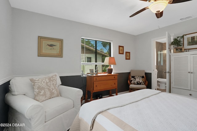 bedroom with ensuite bath and ceiling fan