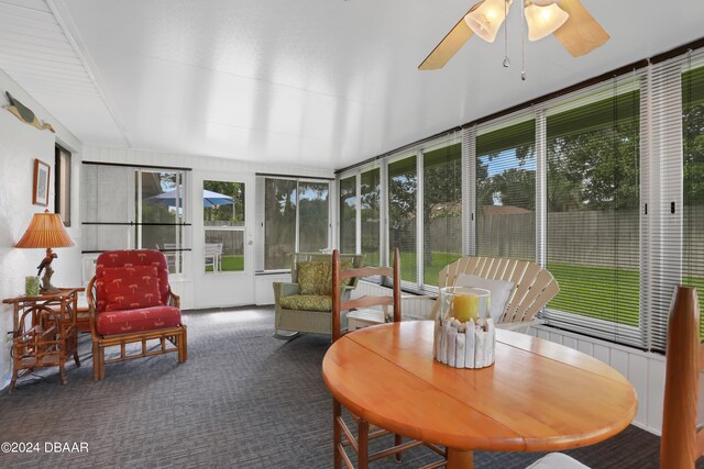 sunroom / solarium with ceiling fan