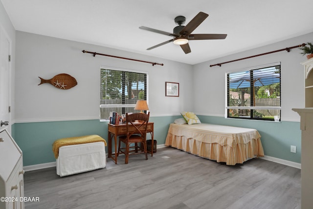 bedroom with ceiling fan and light wood-type flooring