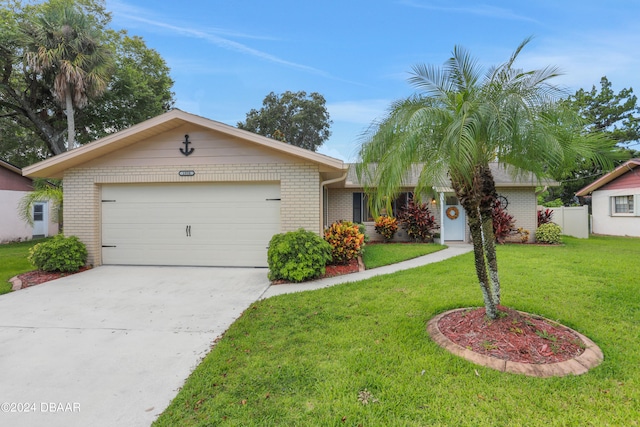 ranch-style house with a garage and a front yard