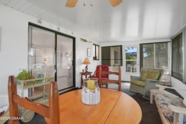 sunroom featuring ceiling fan