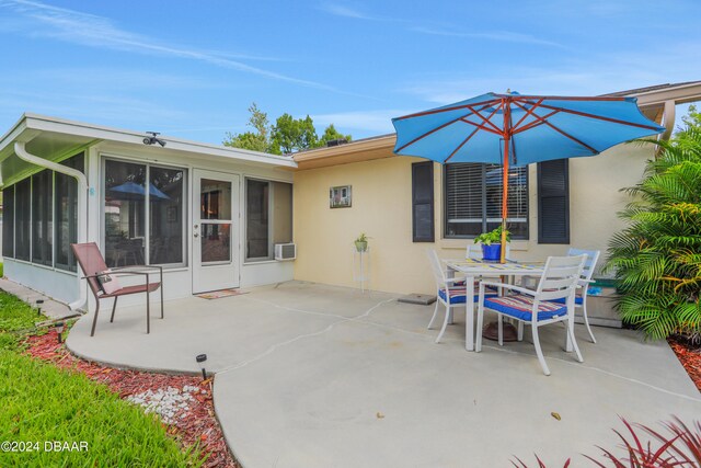 view of patio / terrace with a sunroom